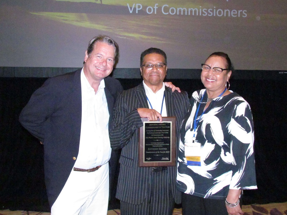 Commissioner Sawyer with award