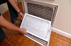 Person changing A/C Filter